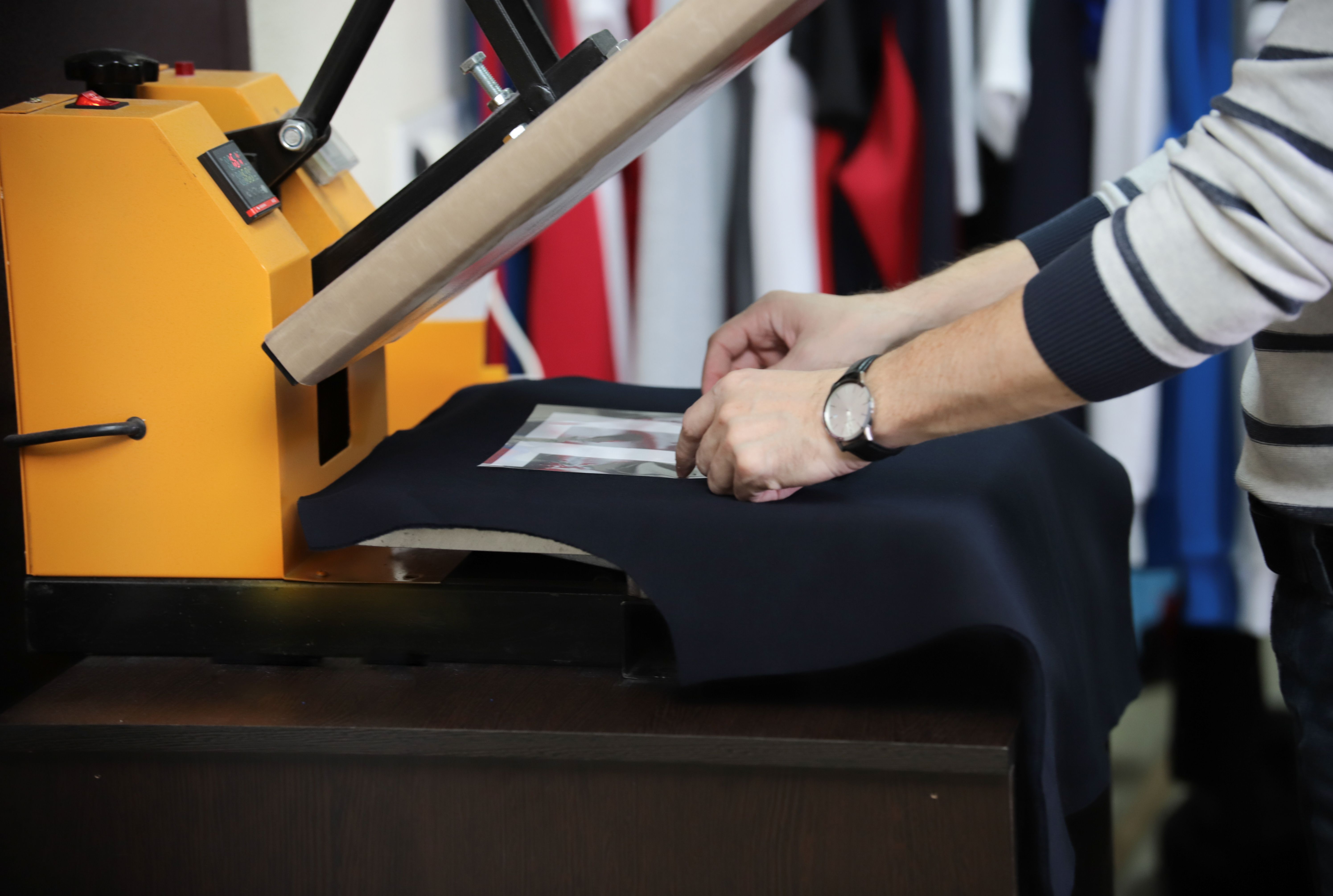 Designer working on a personal T-shirt logo draft – focus on professional production and quality